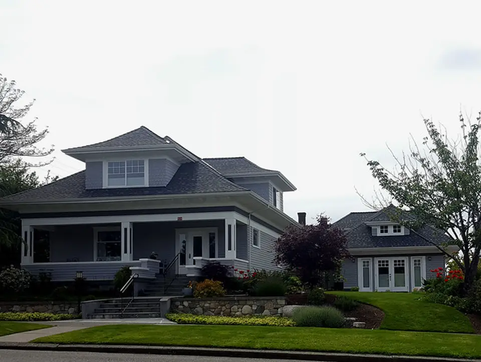 A craftsman house with a backyard cottage